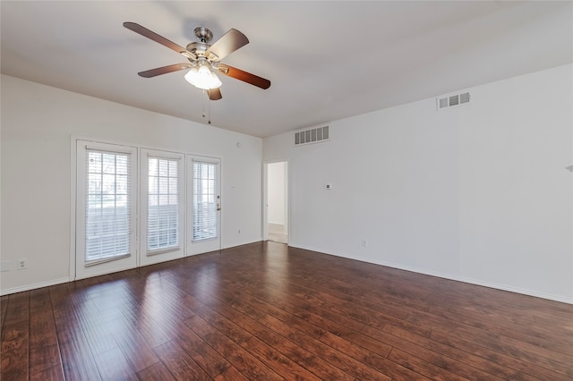 spare room with ceiling fan and dark hardwood / wood-style flooring