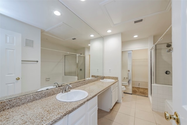 bathroom featuring vanity, tile patterned floors, toilet, and an enclosed shower