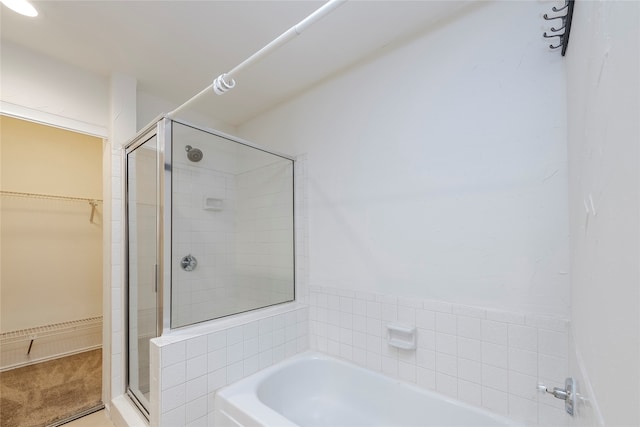 bathroom with shower with separate bathtub