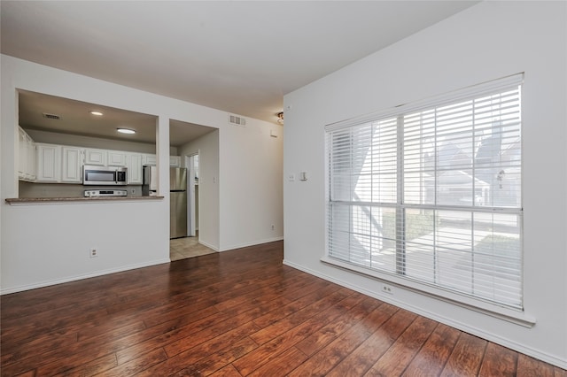 unfurnished living room with light wood-type flooring