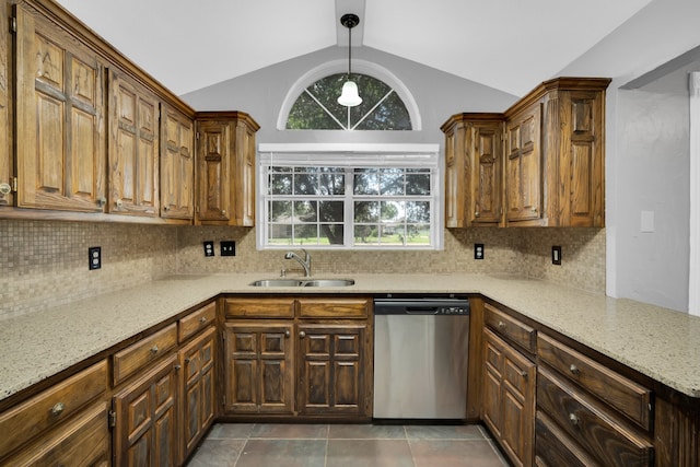 kitchen featuring lofted ceiling, dishwasher, backsplash, sink, and pendant lighting