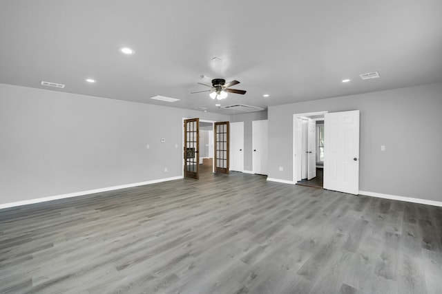 empty room featuring ceiling fan and hardwood / wood-style floors