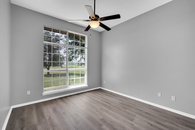 spare room with hardwood / wood-style flooring and ceiling fan