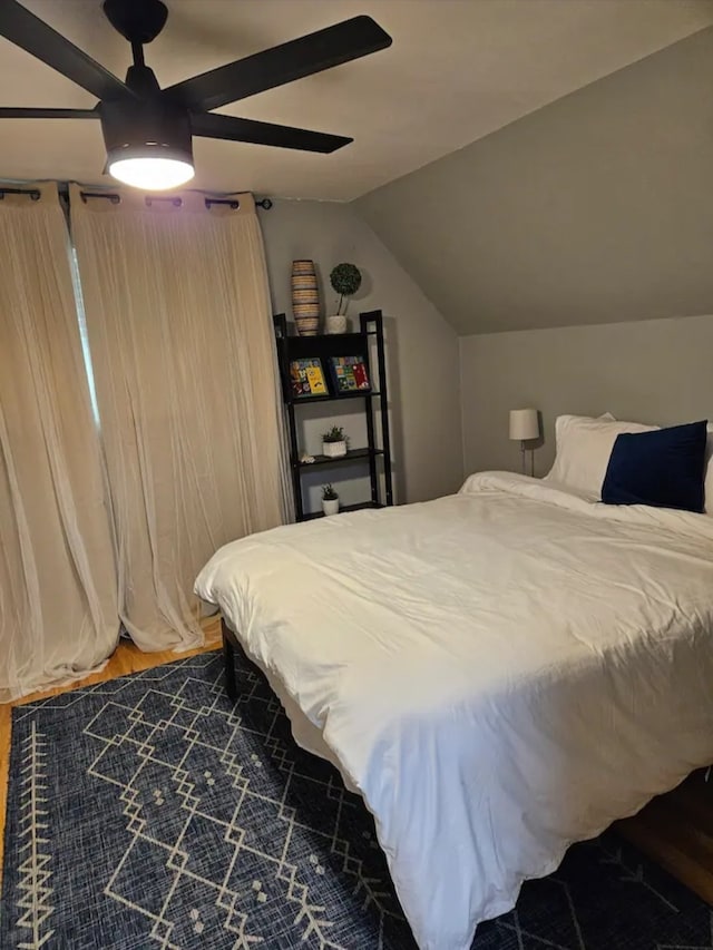 bedroom featuring lofted ceiling and ceiling fan