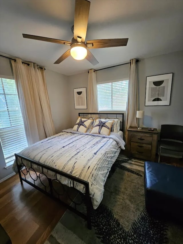 bedroom featuring dark wood-type flooring and ceiling fan