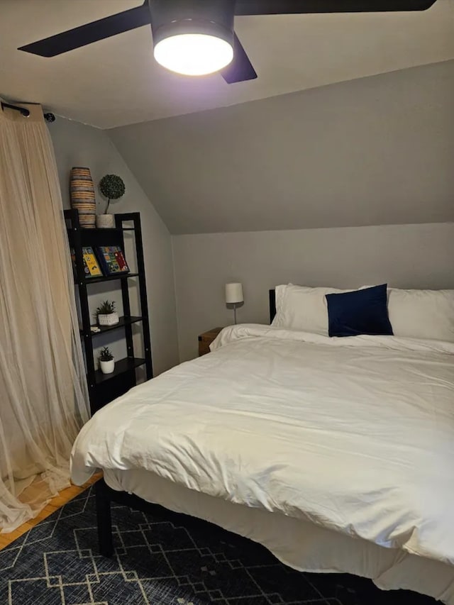 bedroom featuring ceiling fan and vaulted ceiling