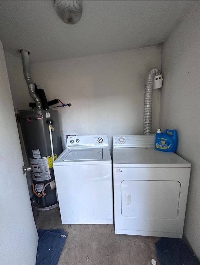 laundry room with washer and clothes dryer and gas water heater