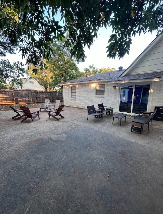 view of patio / terrace featuring an outdoor fire pit