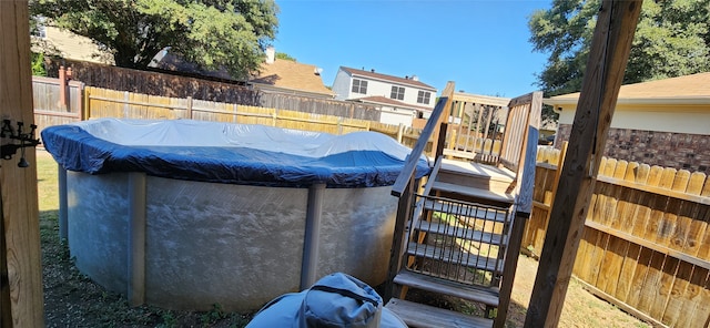 view of swimming pool with a deck