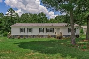 back of house with a lawn