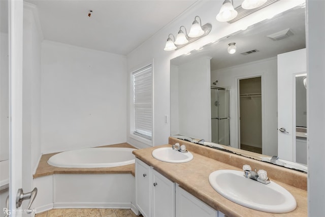 bathroom with vanity, tile patterned floors, and plus walk in shower