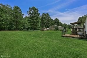 view of yard featuring a wooden deck