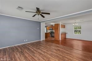 unfurnished living room with ceiling fan with notable chandelier and dark hardwood / wood-style flooring