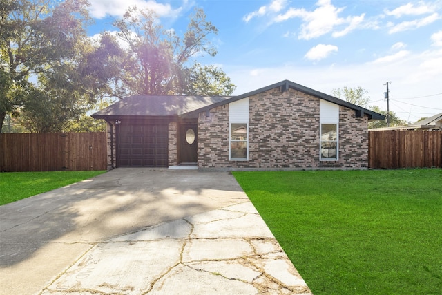 ranch-style home with a front lawn and a garage