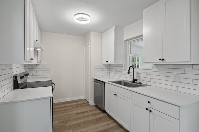 kitchen featuring white cabinetry, dishwasher, light hardwood / wood-style flooring, and sink