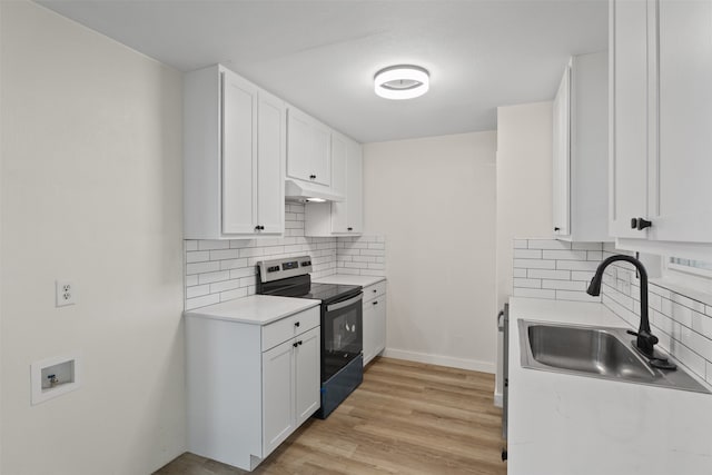 kitchen featuring backsplash, sink, light hardwood / wood-style flooring, white cabinetry, and stainless steel range with electric cooktop