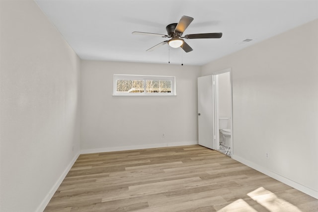 empty room featuring ceiling fan and light wood-type flooring