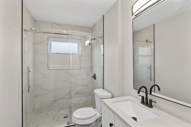 bathroom with vanity, toilet, and an enclosed shower