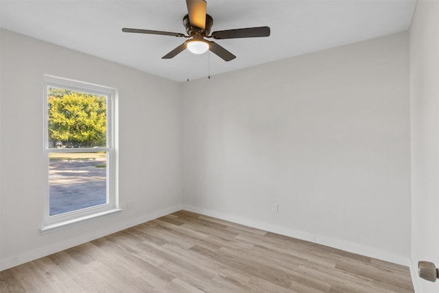 spare room featuring ceiling fan and light hardwood / wood-style flooring