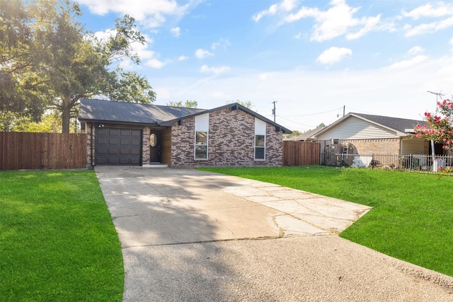 ranch-style home featuring a front lawn and a garage