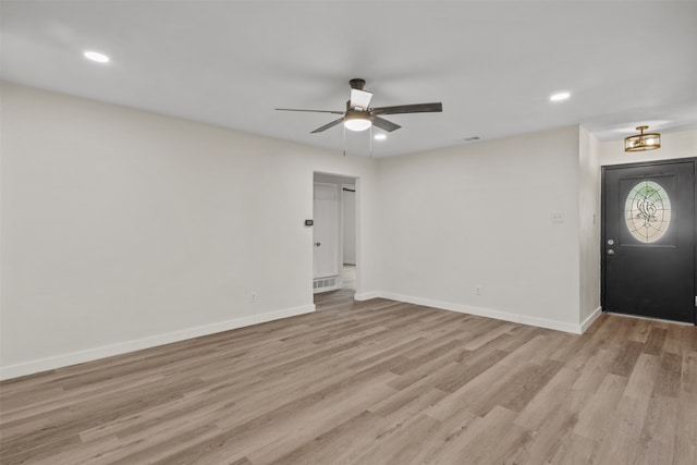 entrance foyer with ceiling fan and light hardwood / wood-style flooring