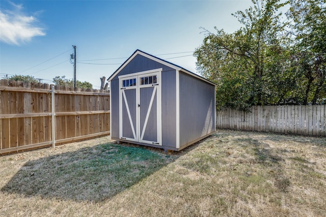 view of outbuilding featuring a yard