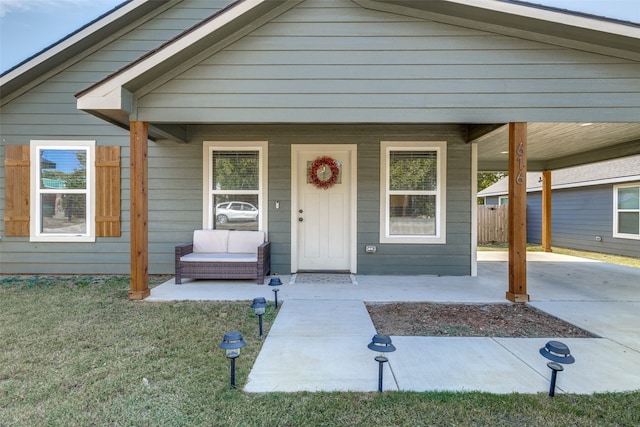 bungalow-style home featuring a porch and a front lawn