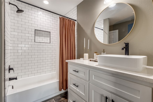 bathroom with vanity and shower / tub combo with curtain