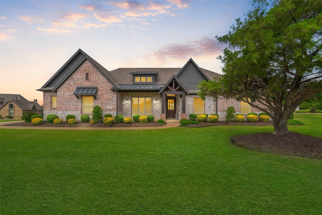 craftsman house with a lawn