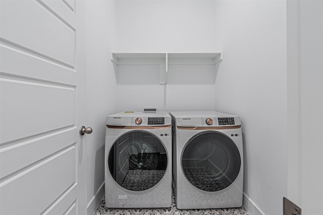 washroom featuring washer and dryer