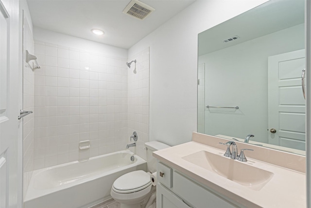 full bathroom with vanity, toilet, and tiled shower / bath combo