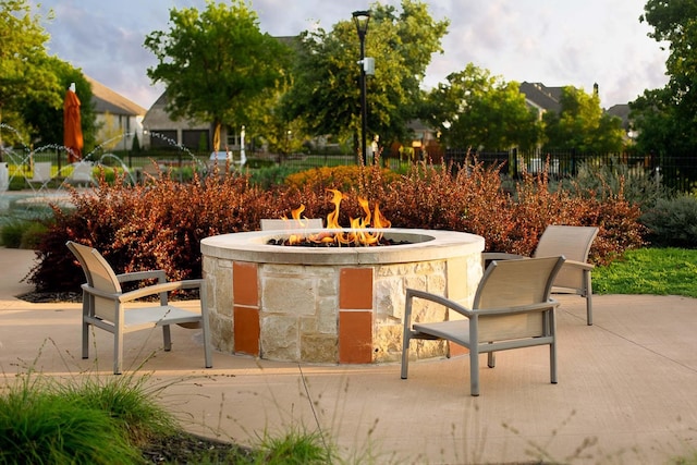 view of patio featuring an outdoor fire pit