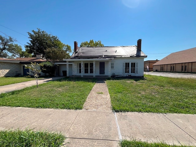 bungalow with a front yard