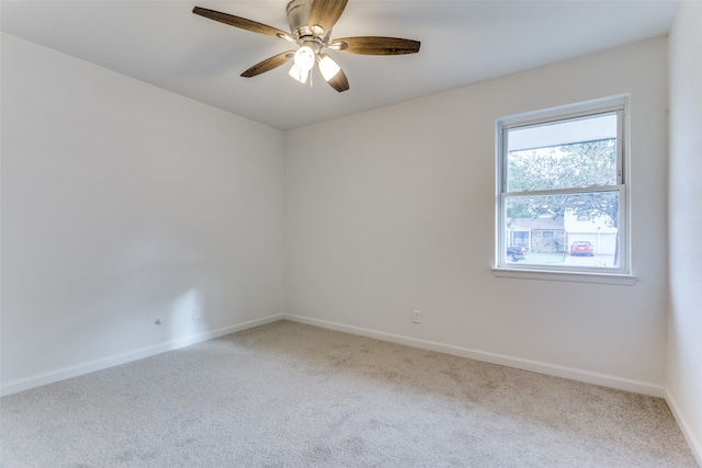 unfurnished room featuring ceiling fan and carpet floors