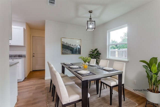 dining room with light wood-type flooring