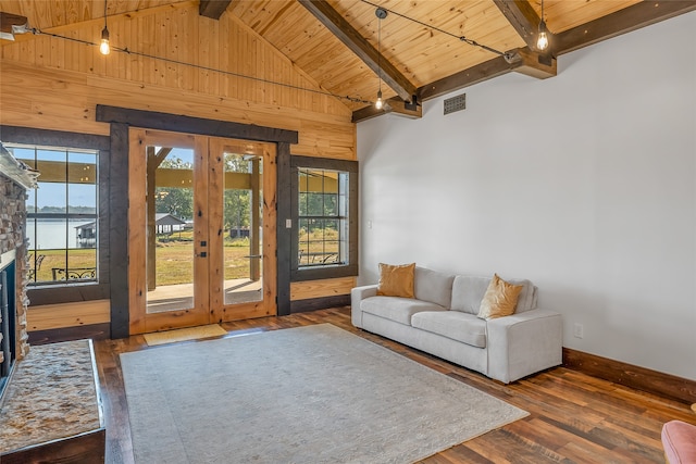 unfurnished living room with dark hardwood / wood-style flooring, french doors, beamed ceiling, and a water view