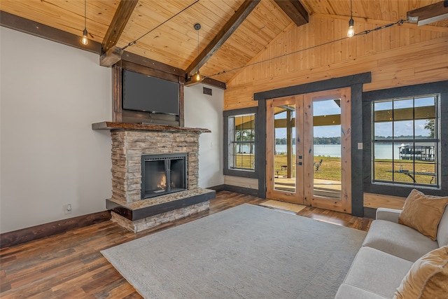 unfurnished living room with wood ceiling, beam ceiling, high vaulted ceiling, dark hardwood / wood-style flooring, and a stone fireplace