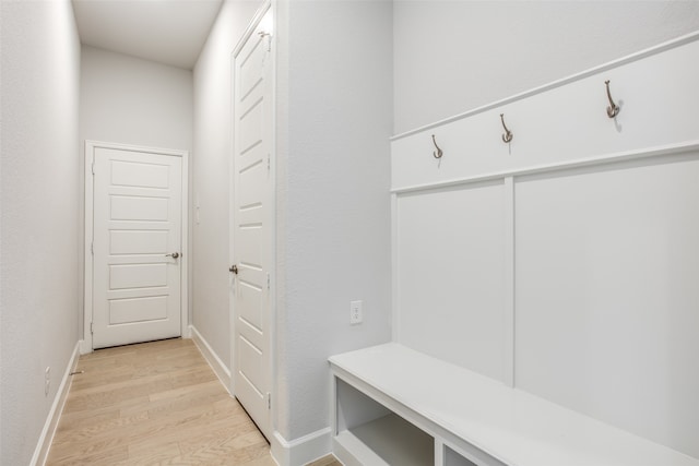 mudroom with light hardwood / wood-style floors