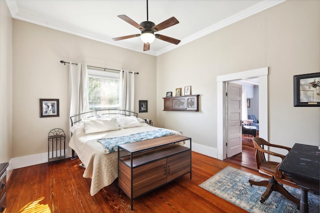 bedroom with dark wood-type flooring, ceiling fan, and crown molding