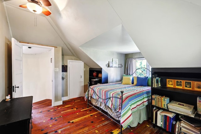 bedroom featuring ceiling fan, vaulted ceiling, and dark hardwood / wood-style floors