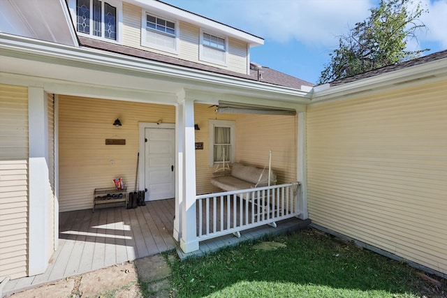 property entrance featuring covered porch