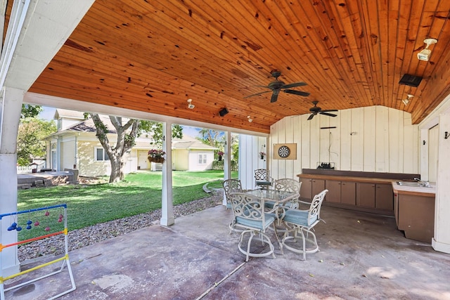 view of patio featuring a storage unit and ceiling fan