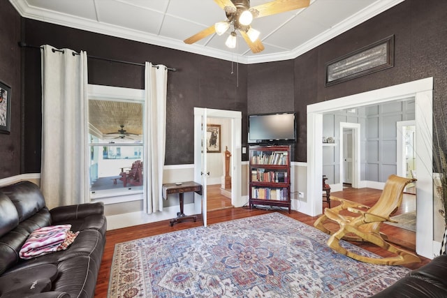 interior space featuring ornamental molding, hardwood / wood-style flooring, and ceiling fan