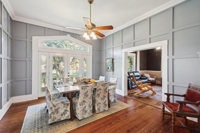 dining room featuring crown molding, ceiling fan, french doors, and dark hardwood / wood-style flooring