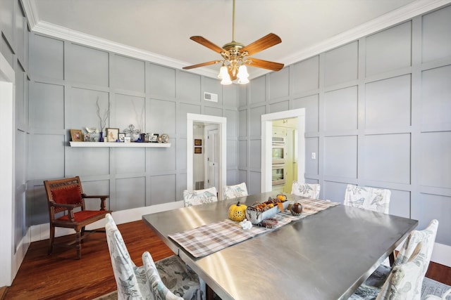 dining space with ornamental molding, dark hardwood / wood-style floors, and ceiling fan