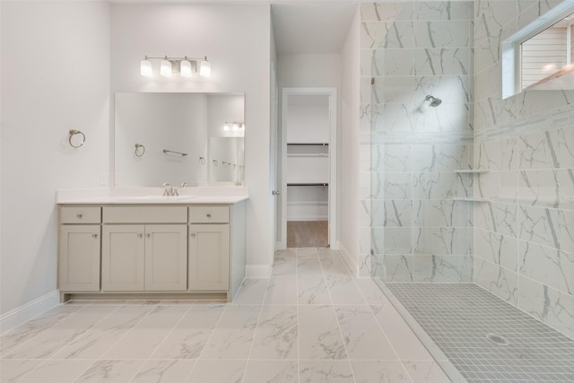 bathroom with vanity and tiled shower