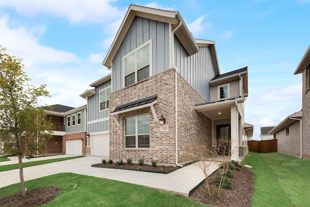 view of front facade featuring a garage and a front lawn