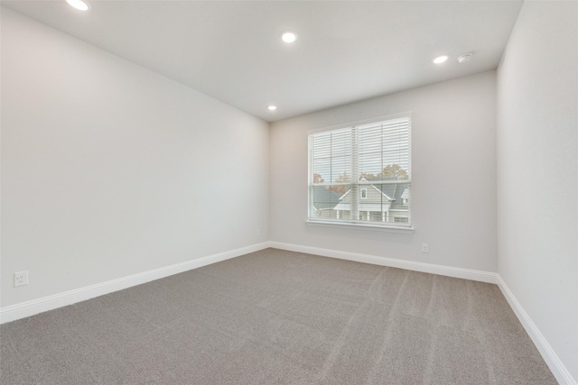 spare room with carpet floors