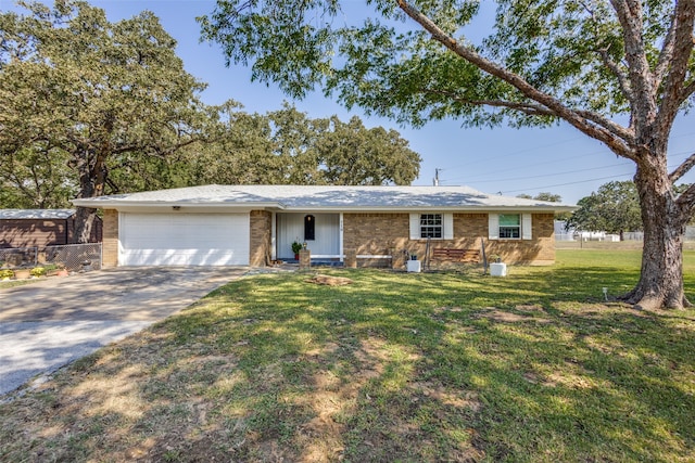 single story home with a garage and a front lawn