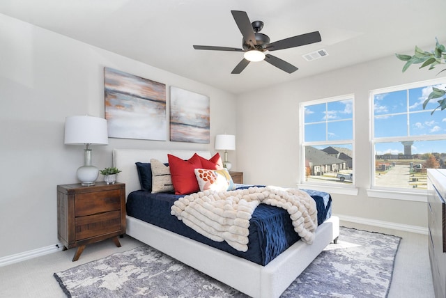 bedroom with ceiling fan and carpet